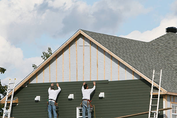 Professional Siding technician working in Owings, MD